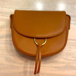 Brown cross bag. New.  With strap and tassel